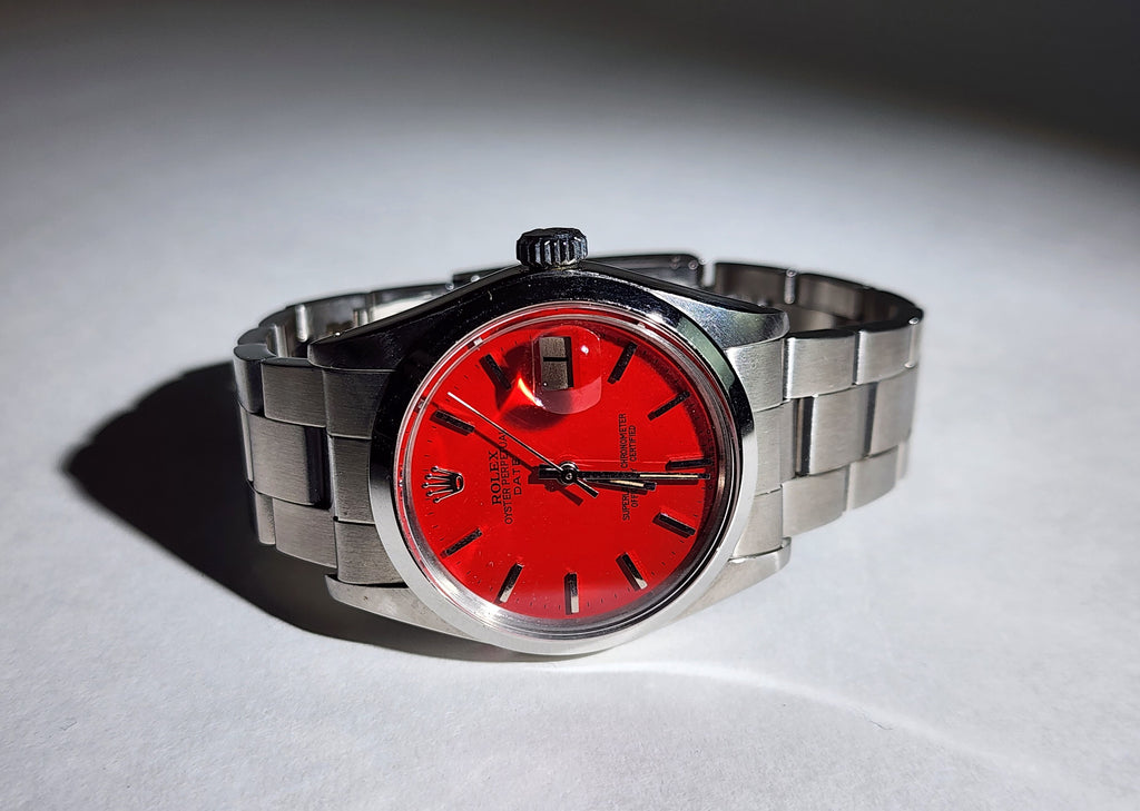 Custom Vintage Rolex Date Just with a red dial and an original stainless steel band.
